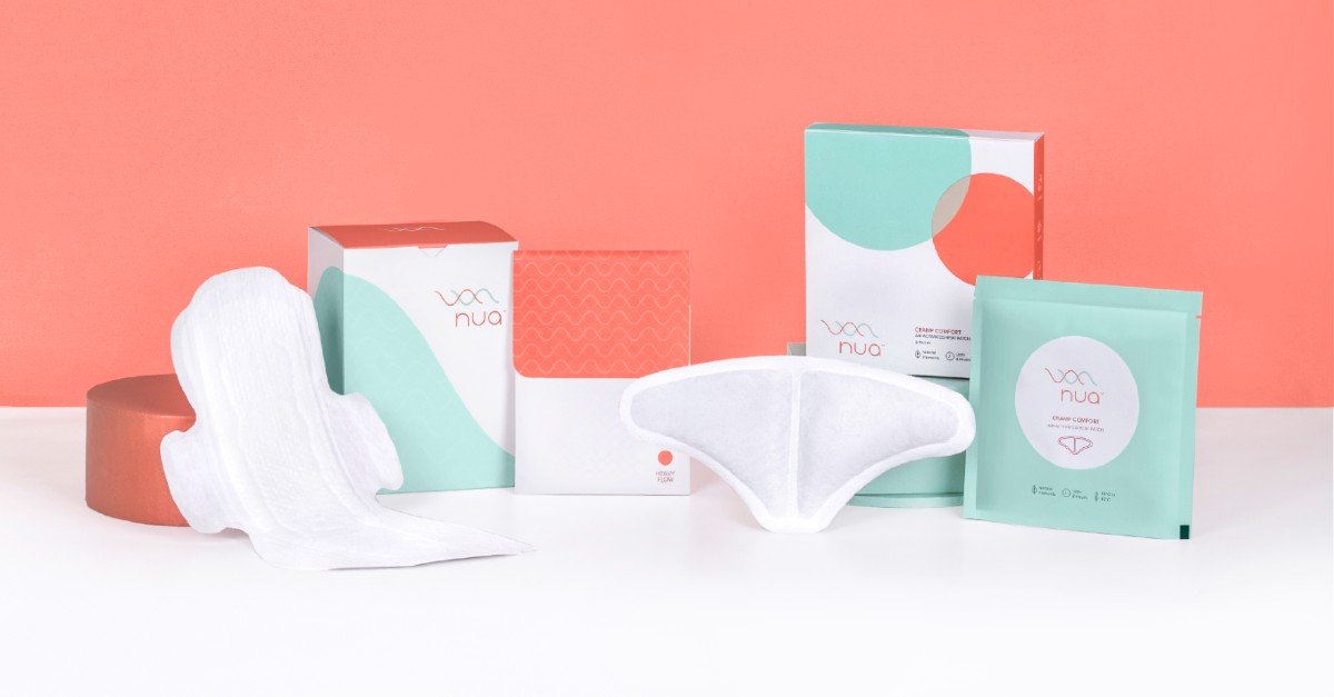 NUA period care products arranged on a coral background